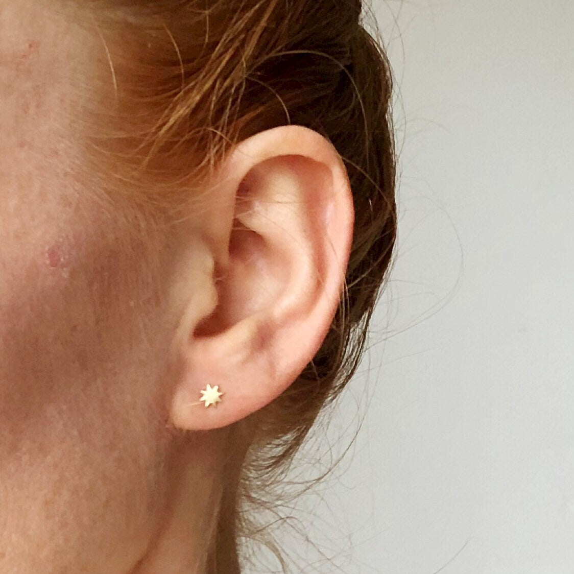 NORR star ear jacket earrings